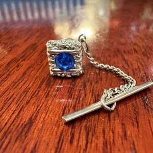 Blue gemstone tie tac. September birthstone. Silver tone. Nugget style.